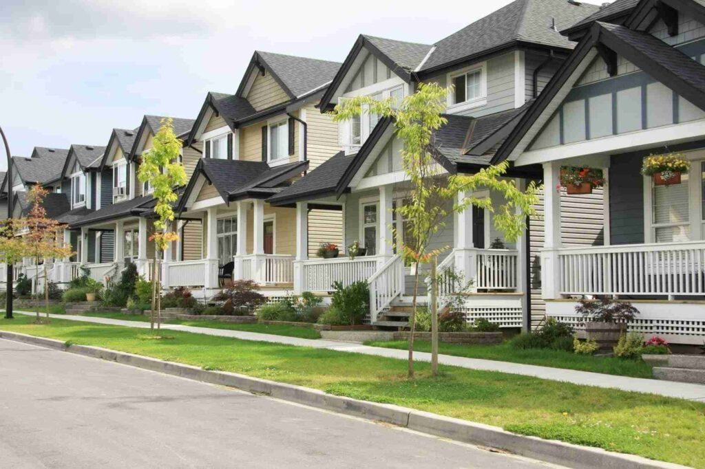 Row of suburban houses with front porches.
